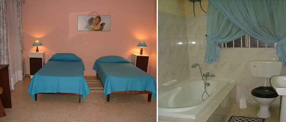 Twin bedroom and bathroom in a Compass self-catering apartment in Bugibba